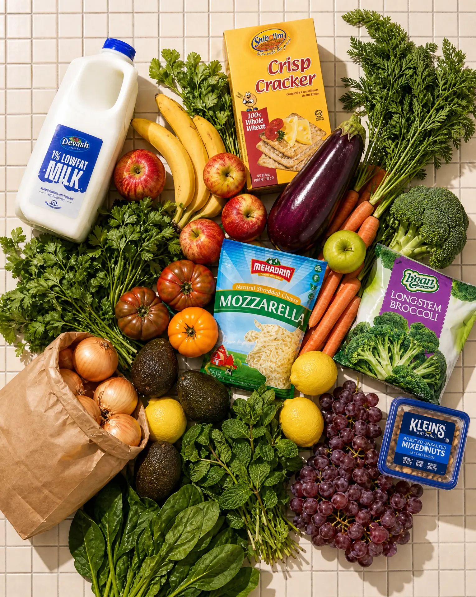 A grocery bag with fresh produce, milk, cheese, crackers, and vegetables